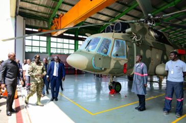 Gabon's Prsident Brice Oligui Nguema and delegation inspecting some of the military helicopters being worked on at Nakasongola during his tour of the facilities on Friday. PPU Photo.jpg b