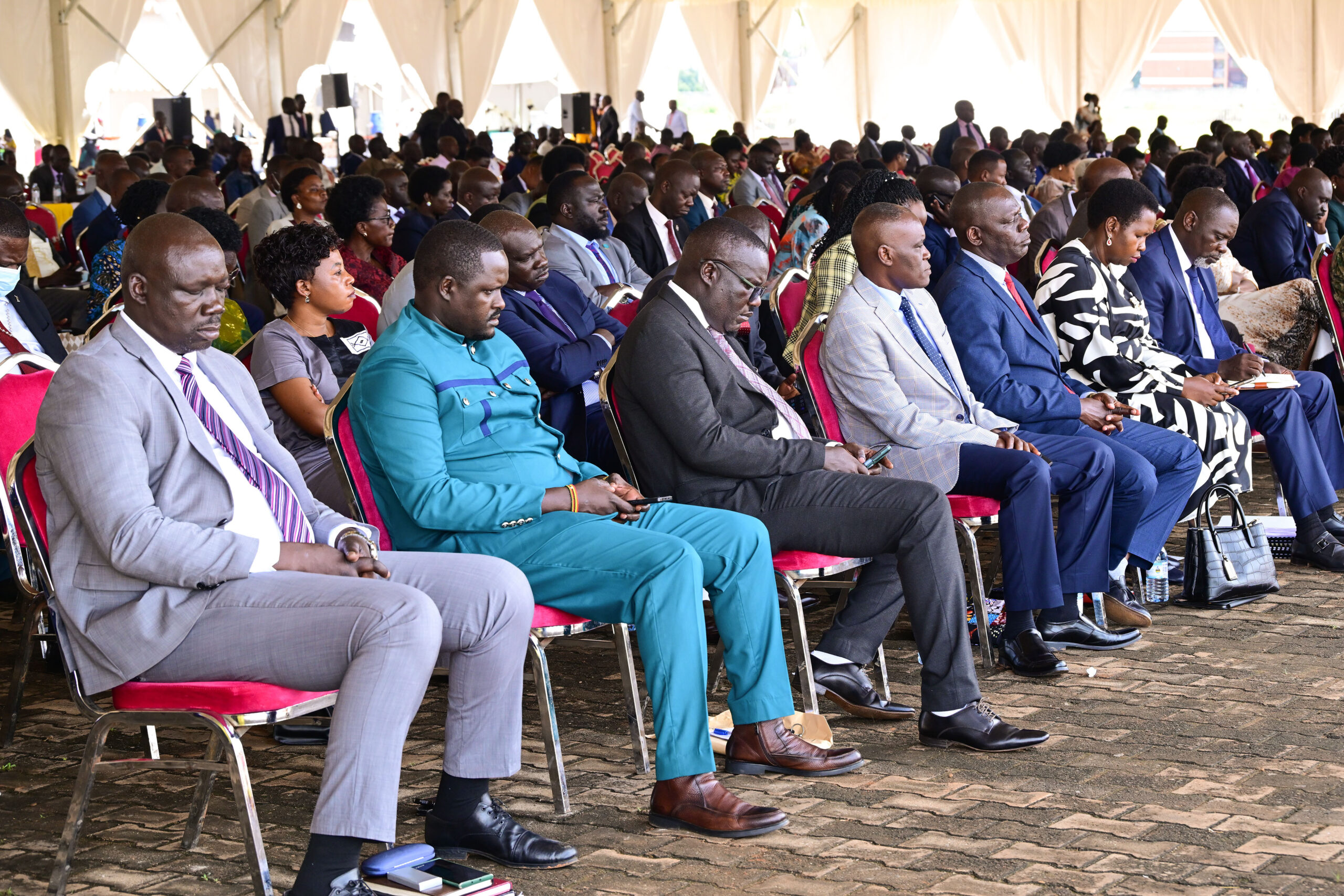 Some of the ministers and members of parliament listening to President Museveni's address during the parliamentary session at Kaunda grounds in Gulu on Thursday. PPU Photogulu39