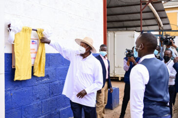 President Museveni commissioning Royal Milk Factory in Nalukolongo on Wednesday as the compoany MD Swaleh Kigoye (R) looks on. PPU Photo