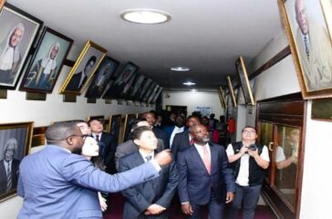 Tayebwa in corridor of honour with Chinese delegation RESIZED