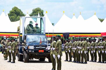 President-Museveni-watches-a-military-parade-by-cadet-officers-during-their-passout-at-the-Uganda-Military-Academy-in-Kabamba-on-Tuesday.-PPU-Photokabamba20-scaled