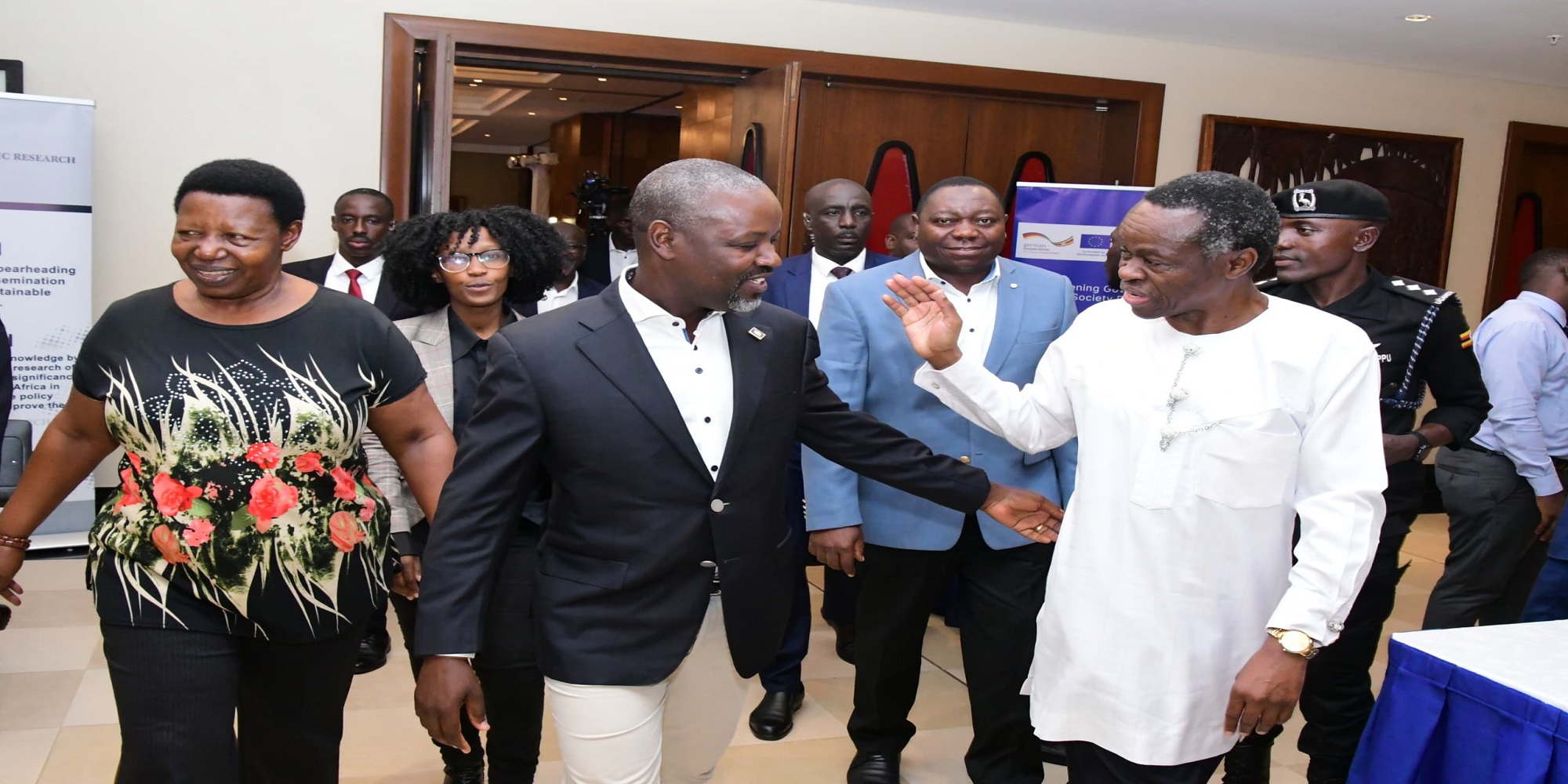 Tayebwa (c) interacts with Prof Patrice Lumumba, a Kenyan lawyer and public speaker. On his right is former MP, Hon. Miria Matembe