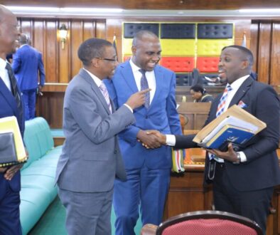 The Attorney General, Kiryowa Kiwanuka (2nd L) and State Minister for Finance, Musasizi interact with the LoP, Joel Ssenyonyi (R) as Hon. Achia looks on