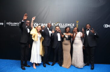Azhar Sundhoo,(C),CEO C-Care Uganda poses for a picture with C-Care staff and some invited guests at the award ceremony