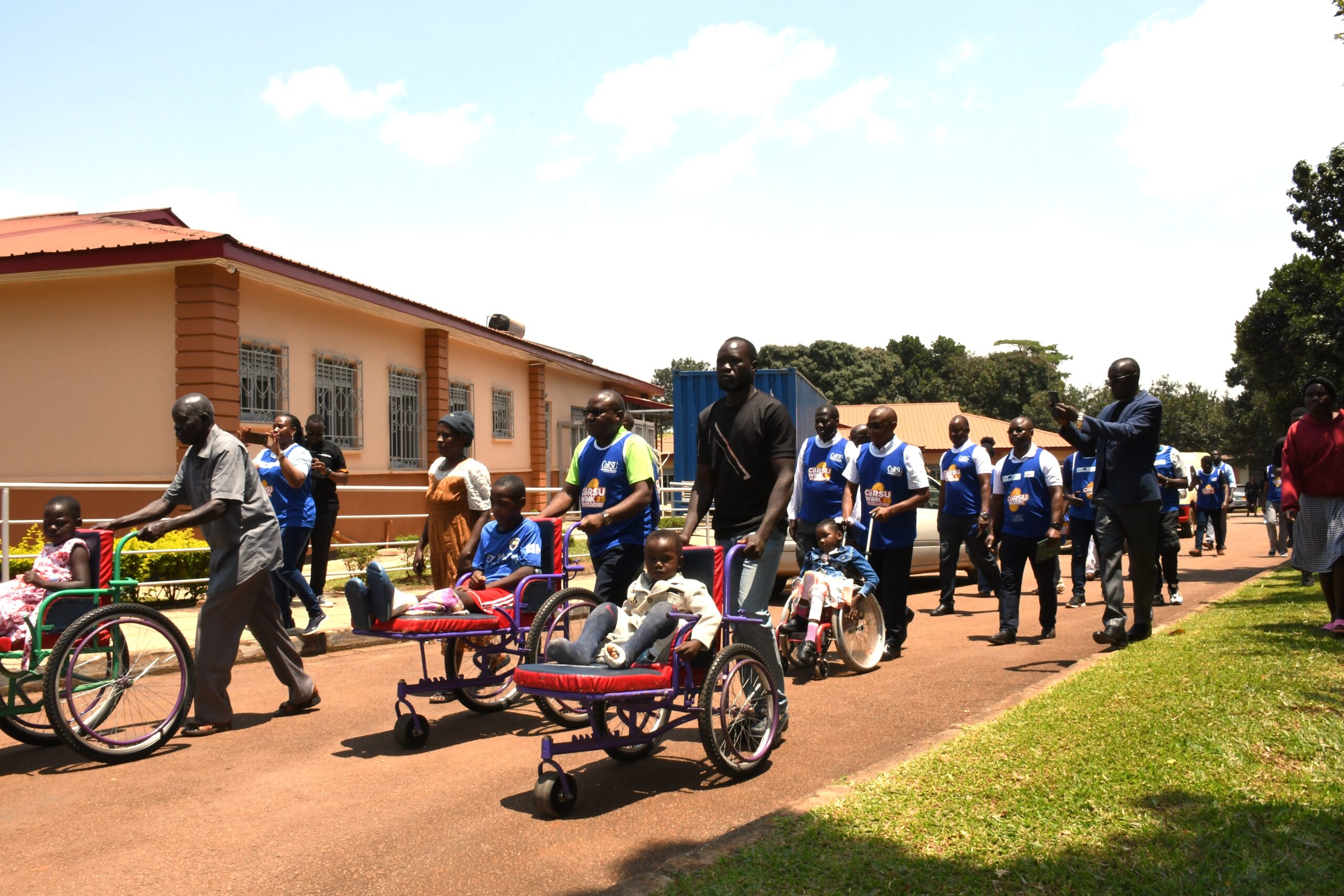 Some of the hospital staff and partners walking alongside some the children treated at the CoRSU Hospital Some of the hospital staff and partners walking alongside some the children treated at the CoRSU Hospital
