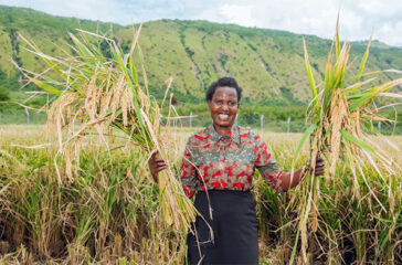 A farmer shows off her first harvest A farmer shows off her first harvest