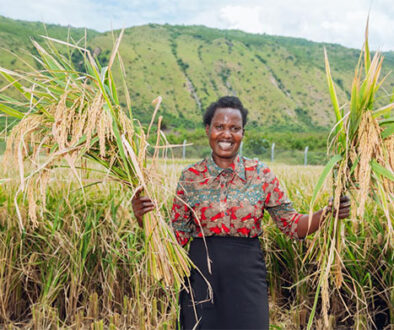 A farmer shows off her first harvest