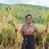 A farmer shows off her first harvest