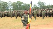 Col-Musenene-Holding-the-Uganda-Flag-1600x800 Another UPDF battle group flaged off to Somalia