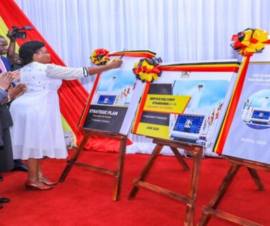 Hon. Afoyochan cuts a ribbon to mark the launch of the Strategic Plan