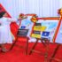 Hon. Afoyochan cuts a ribbon to mark the launch of the Strategic Plan