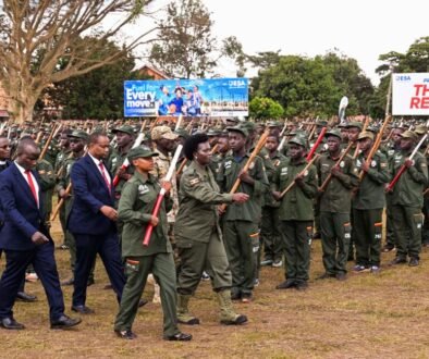 Commissioner Patriotism Helen Seku inspecting the parade during the passout of over 2500 patriotism students and teachers of Kings College Buddo on Saturday. PPU Photo
