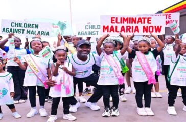 Deputy Speaker Tayebwa (in black cap) with children who took part in the walk