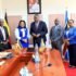 Oboth (C) with officials from the tribunal after their meeting 