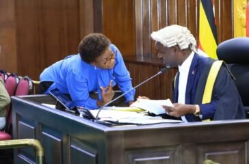 Deputy Speaker Tayebwa (R) confers with the Government Chief Whip, Hon. Jane Ruth Aceng