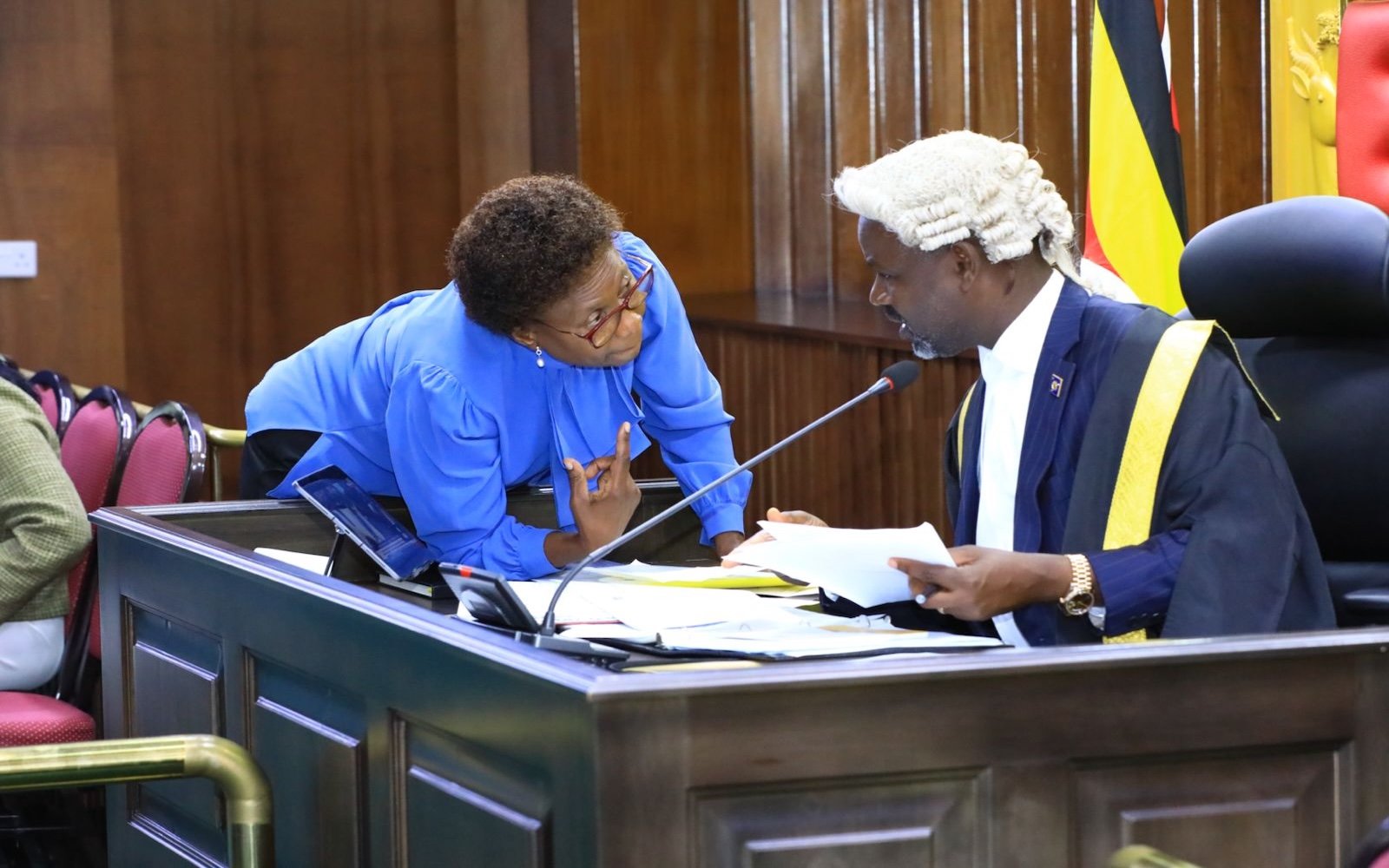 Deputy Speaker Tayebwa (R) confers with the Government Chief Whip, Hon. Jane Ruth Aceng