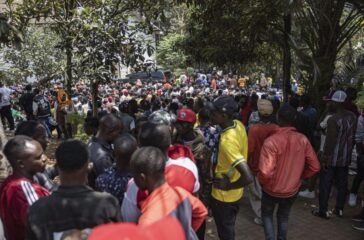 Burundian nationals gather outside their embassy to apply for border passes as they prepare to travel back to their country following the Kenyan governmen
