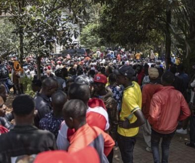 Burundian nationals gather outside their embassy to apply for border passes as they prepare to travel back to their country following the Kenyan governmen
