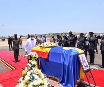 President Museveni paying his respect after laying a wreath on the casket containing the remains of King Oyo at Entebbe Airport on Friday. PPU Photo.