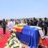 President Museveni paying his respect after laying a wreath on the casket containing the remains of King Oyo at Entebbe Airport on Friday. PPU Photo.