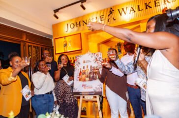 UBL executives join Christopher Kafure for a celebratory toast following the launch of the Gift the Cheer of the Season catalogue at House of Walker, Wandegeya. (2)